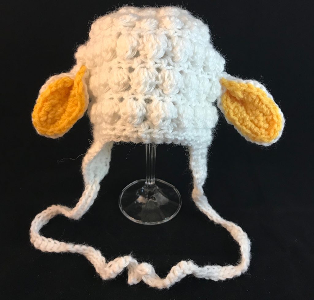 Adorable Crocheted Baby Lamb Hat With Yellow Ears Yarn and Paper